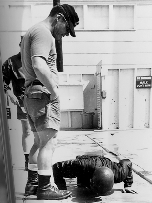 Figure 3 Instructor Terry Moy encouraging a SEAL candidate