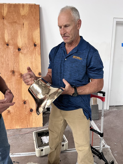 Figure 1 Chief Warrant Officer Lance Cummings, US Navy (ret.) opening the case containing the bell